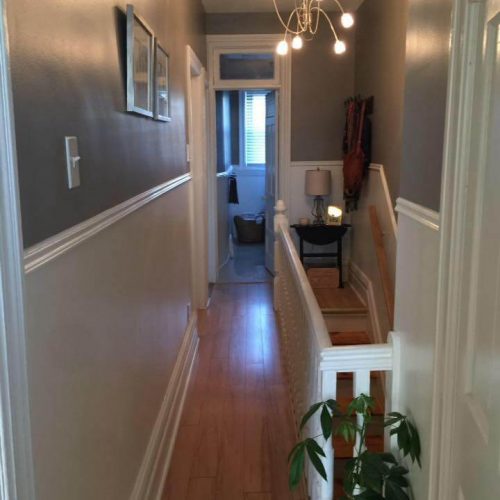 painting of hallway corridor with two tones of gray paint colour