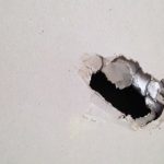 hole in the wall before drywall repairs