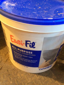 bucket of easi fil all purpose drywall compound used by professional painters