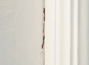 cracking or breaking paint at joint of wall and trim work