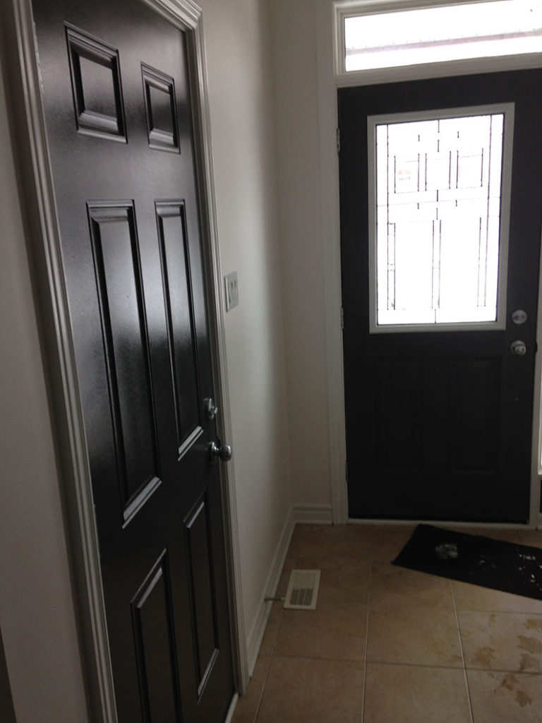 interior painting of doors in dark paint colour painted by PG PAINT & DESIGN painting company in Ontario Ottawa