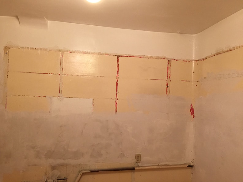 unpainted interior wall before painting with drywall patching and repair